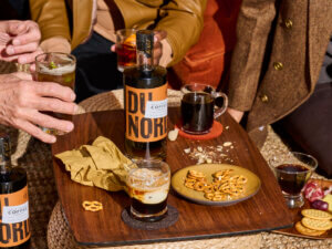 Bottle of Cafe Freida Coffee Liqueur and a cocktail scene